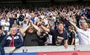 aficionados en un estadio